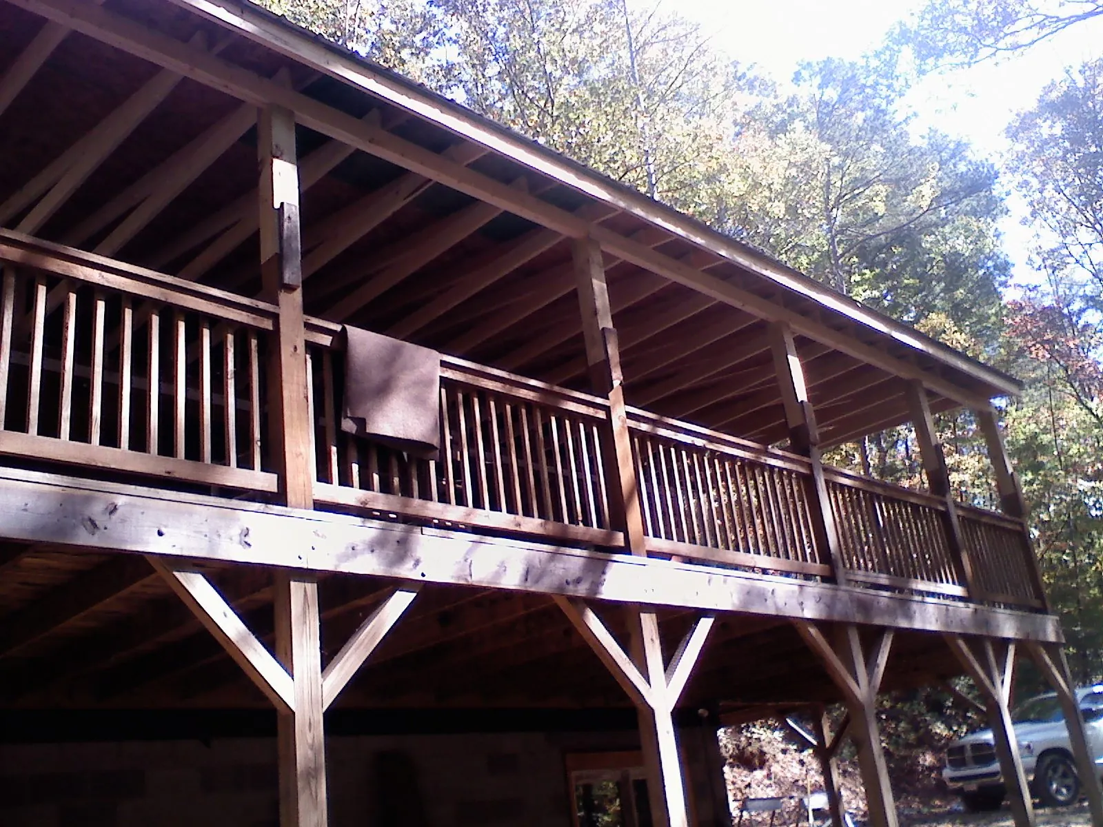 Timber framing under a new elevated porch and deck — Roof Leak Repair in Cumming by Roofing Brothers